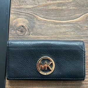 Michael Kors pebble leather black continental wallet.